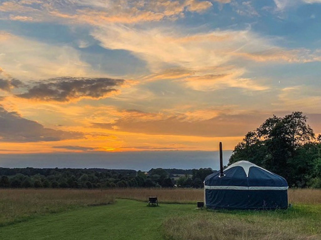 An exterior shot of the Foxglove Yurt at Raynham Estate Glamping