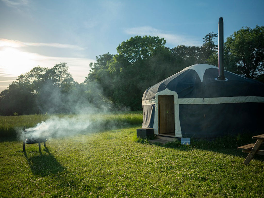 An exterior shot of the Foxglove Yurt at Raynham Estate Glamping