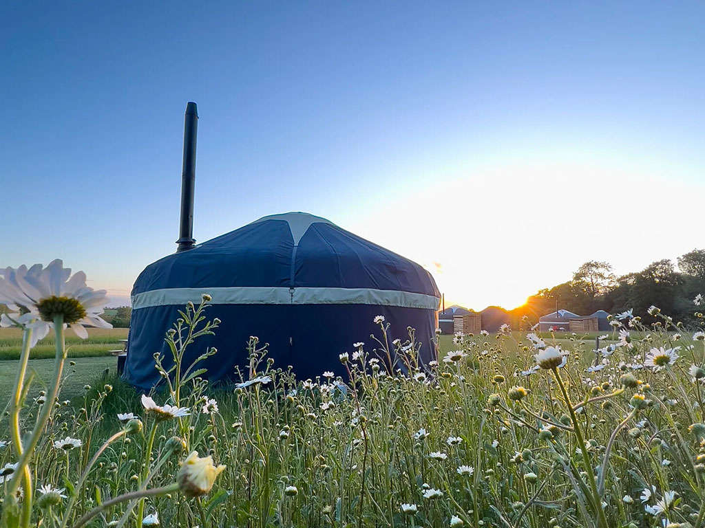 An exterior shot of the Foxglove Yurt at Raynham Estate Glamping