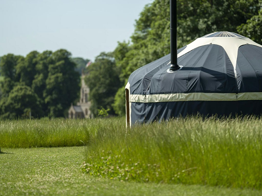 An exterior shot of the Foxglove Yurt at Raynham Estate Glamping